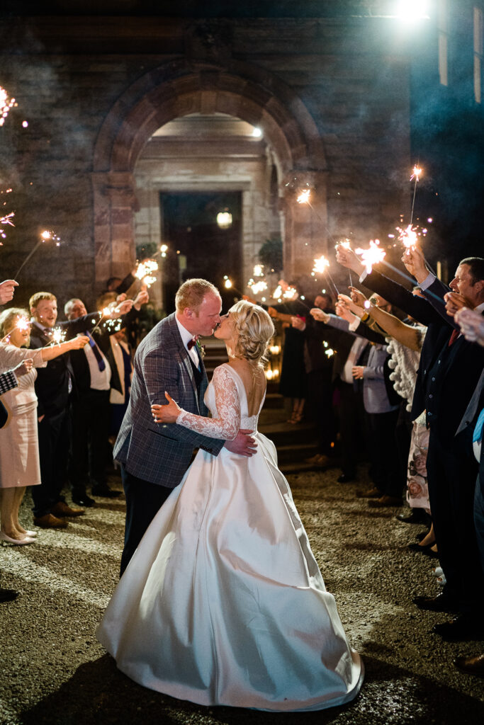 Relaxed and fun wedding sparkler exit at Castle Leslie Estate photographed by Gemma G Photography